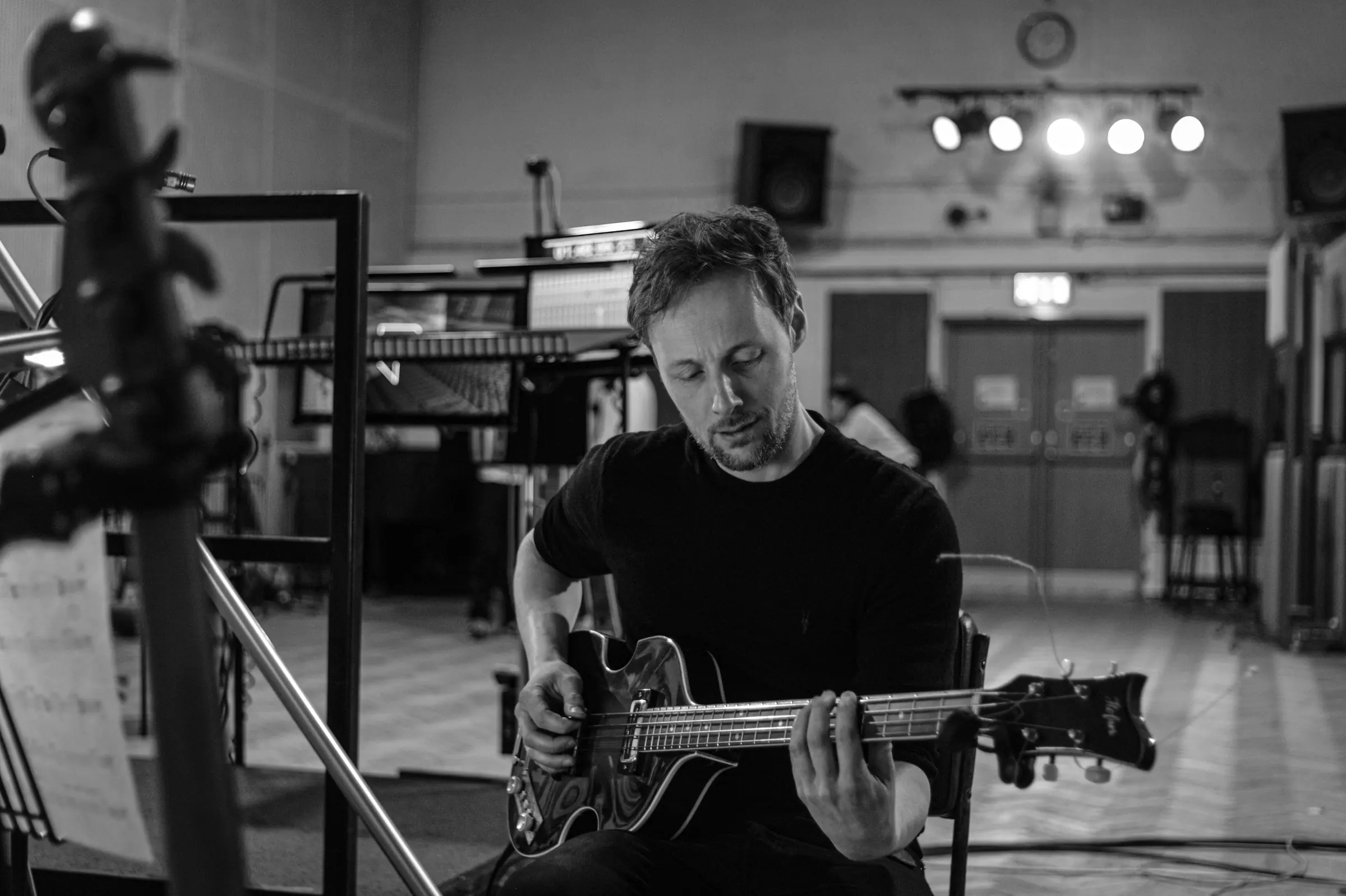 Chris Hill playing bass in the studio
